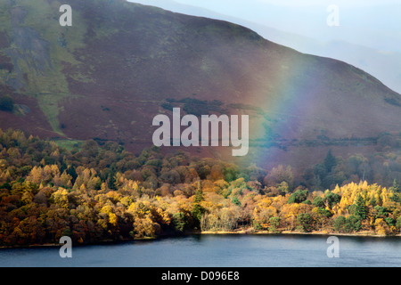 Rainbow over Derwentwater from Surprise View in Ashness Woods near Grange Cumbria England Stock Photo