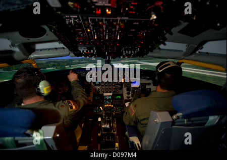 Pilots from McConnell Air Force Base complete a training session using the updated KC-135 Stratotanker simulator on Nov. 13, 2012. The simulator’s HD graphics improve realism for training in aerial refueling operations. Stock Photo