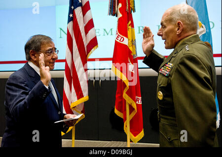 US Secretary of Defense Leon Panetta administers the oath of office to General John Kelly at his promotion ceremony prior to the Southern Command Change of Command November 19, 2012 in Miami, FL. General Kelly took over the command from General William Fraser III. Stock Photo