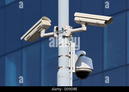 three cctv security cameras on street pylon Stock Photo