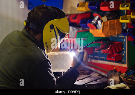 Man aluminium welding Stock Photo