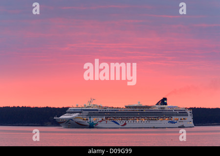 Sunrise with the Norwegian Dawn entering Bar Harbor, Acadia N.P, Maine. Stock Photo