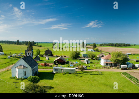 Church and houses in Flora, Oregon, with the Wallowa Mountains in the background. Stock Photo