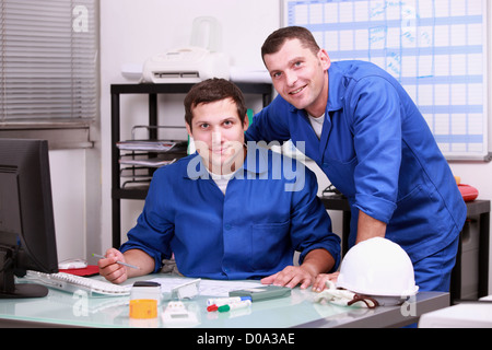two technicians working in office Stock Photo