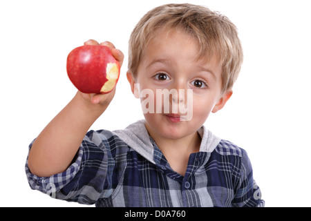 Boy eating a red apple Stock Photo