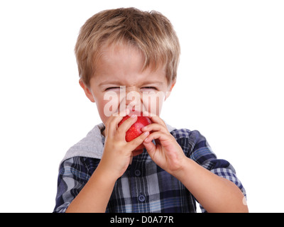 Boy biting a red apple Stock Photo