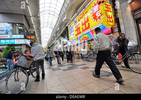 Tenjinbashi-suji shopping street. At about 2.6km, it's Japan's longest covered shopping street. Stock Photo