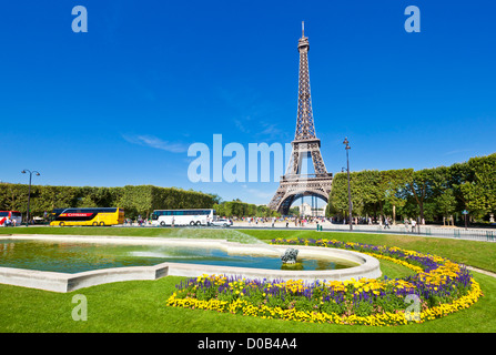 Tour buses in front of the Eiffel Tower Champs de Mars gardens Paris France EU Europe Stock Photo