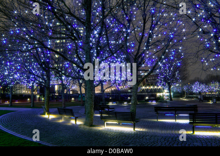 Night shot of Gabriel's Wharf, Southbank, London with blue lights on trees Stock Photo