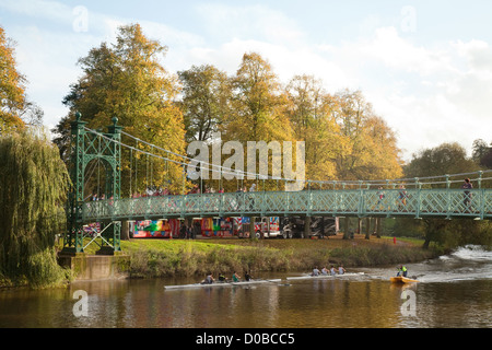 Rowing on the River Severn at the Porthill footbridge, Shrewsbury Shropshire UK Stock Photo