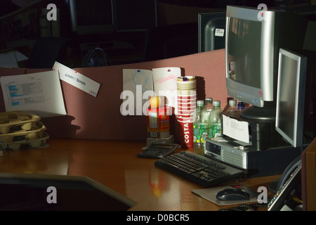 An empty workstation at dawn before a busy day in the office begins. Stock Photo