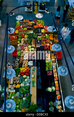 The bounty of a fall harvest on display at an indoor market for fresh fruits and vegetables, Ontario, Canada Stock Photo