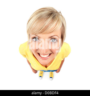 Cute smiling young woman closeup of face with big eyes. Humorous comical wide angle portrait from above isolated on white Stock Photo
