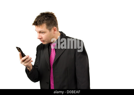businessman is staring at his phone Stock Photo