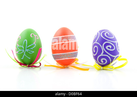 Three colorful easter eggs isolated on white background Stock Photo