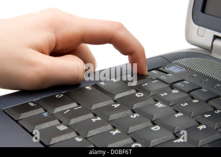 Finger is touching tje escape button on laptop Stock Photo