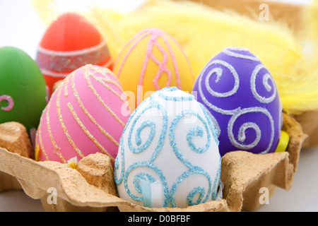 Six colorful easter eggs in box, isolated on white background Stock Photo