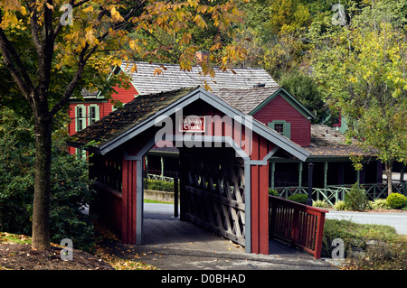 Covered Bridge over Whisky Creek with Visitors Center Behind at Maker's Mark Distillery in Loretto, Kentucky Stock Photo