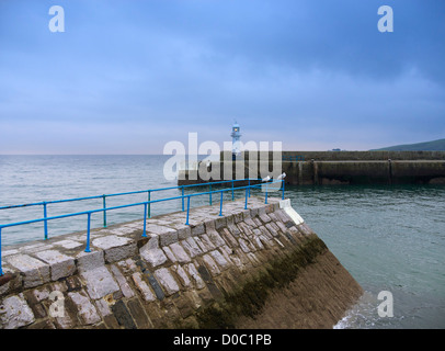 Mevagissey lighthouse, Cornwall. Cast iron lighthouse built in 1896 on the breakwater of the outer harbour. Stock Photo