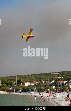 BRAC - JULY 15: Canader fighting wildfire on July 15, 2011 in Brac, Croatia. Stock Photo