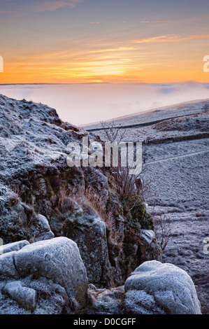 Winter on Peel Crag above Hadrian's Wall one of the dramatic landscapes in Northumberland National Park Stock Photo