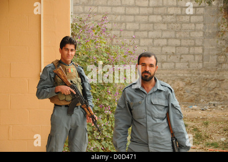 Members of the Afghan National Police (ANP) pose for a photo while providing security at a meeting between the Farah Provincial Stock Photo