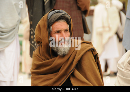 An Afghan man waits to meet with government officials at the provincial governor's compound in Farah City, Nov. 22. PRT Farah's Stock Photo