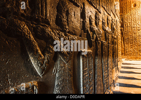 Reliefs at an interior stairway at the Temple of Hathor in Dendera ...