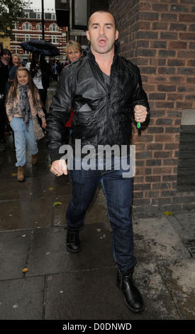 Louie Spence gives snappers an impromptu pole dance, while out and about in Covent Garden! London, England - 26.10.10 Stock Photo