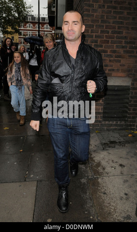 Louie Spence gives snappers an impromptu pole dance, while out and about in Covent Garden! London, England - 26.10.10 :Will Stock Photo