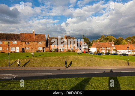 Attractive cottages opposite Kenilworth Castle, in the low autumn Sunlight, Warwickshire Stock Photo