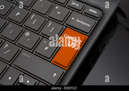 Contact us Return Key symbolizing a call to action request for further information from a website on the internet Stock Photo