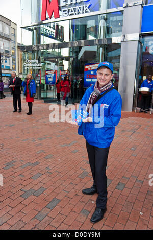 An employee at the opening of the new branch of Metro Bank in Reading, Berkshire on November 23rd 2012. Stock Photo