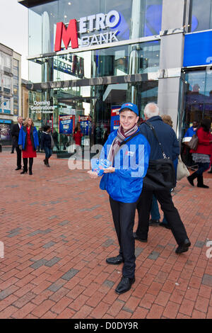 An employee at the opening of the new branch of Metro Bank in Reading, Berkshire on November 23rd 2012. Stock Photo