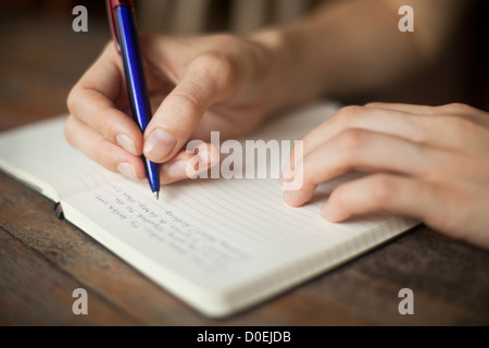 Abstract hands writing on the paper Stock Photo