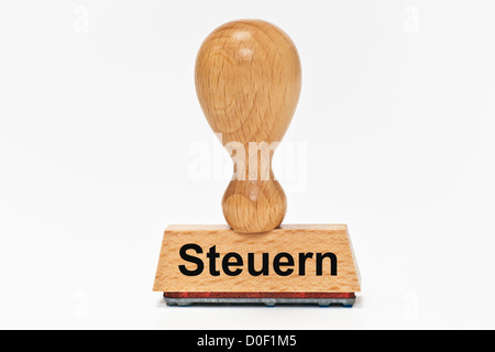 One Stamp with the German inscription Steuern (Taxes) upright, background white. Stock Photo
