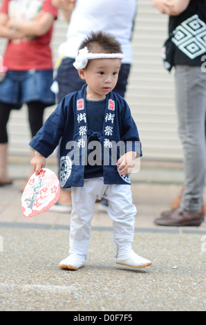 A small boy enjoying himself at the Kishiwada Danjiri festival in Osaka, Japan. Stock Photo