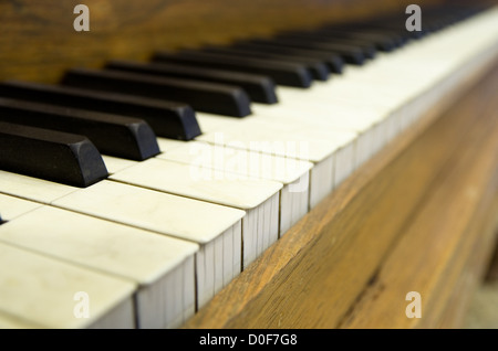 close up perspective image of old piano keys with shallow depth of field Stock Photo