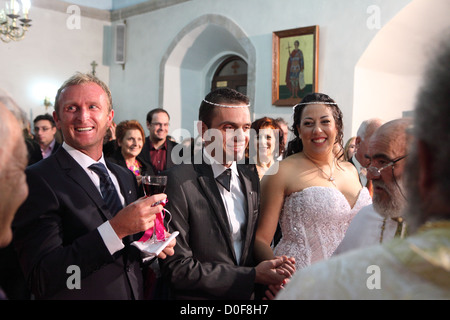 Greek Orthodox wedding ceremony taking place in Crete, Greece Stock Photo