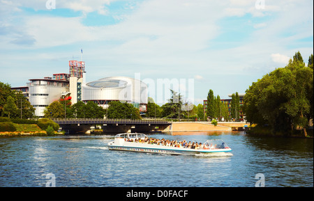 Boat sailing the Rhin river by the European Court of Human Rights building, Strasbourg, Alsace, France Stock Photo