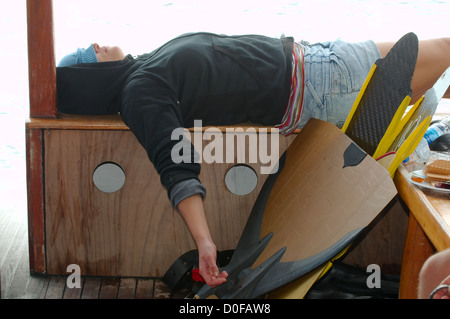 The woman has a rest on divingboat, Kash, Turkey Stock Photo