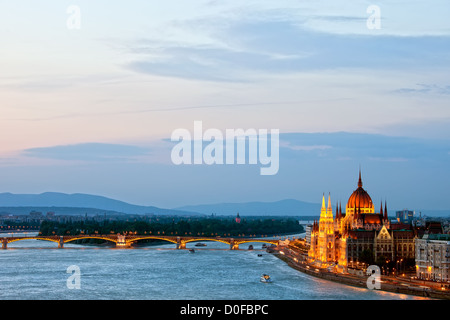 Budapest at dusk with Hungarian Parliament Building and Margaret Bridge on Danube river. Stock Photo