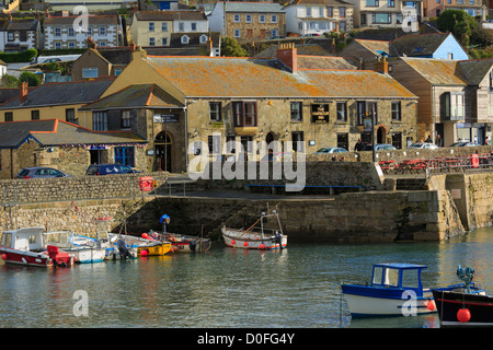 The inner harbour and the Harbour Inn, Porthleven, Cornwall Stock Photo