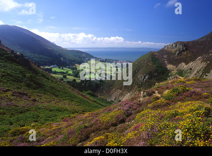 Sychnant Pass View to Dwygyfylchi, Penmaenmawr, Conwy Bay and Anglesey Heather in foreground Snowdonia National Park North Wales Stock Photo