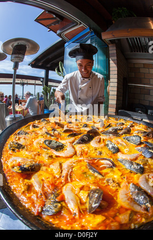 Giant seafood Paella being prepared by a chef in Spanish Restaurant in Playa Blanca, Lanzarote. Canary Islands Stock Photo