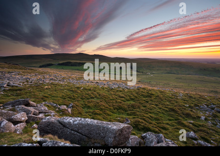 Sunset from the slopes of Belstone Tor with West Mill Tor and Yes Tor in the distance. Dartmoor National Park Devon Uk Stock Photo