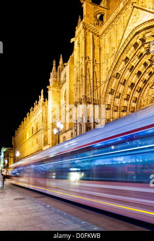 Streetcar passing by in front of Seville's Cathedral, Spain. Stock Photo