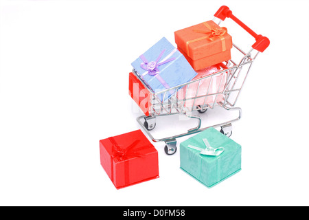 Colorful gift boxes with miniature shopping cart isolated on white background Stock Photo