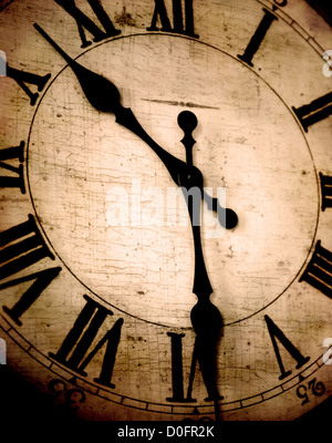 Detail of clock face with numbers and hands showing time Stock Photo