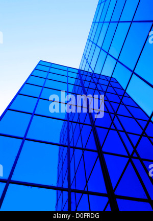 Office building details reflecting, blue sky in geometric windows Stock Photo